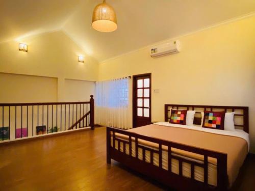 a bedroom with a large bed in a room at Mekong Palm House in Can Tho