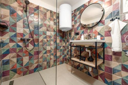 a bathroom with a shower and a mirror at Villa Family Oasis Nin ZadarVillas in Nin