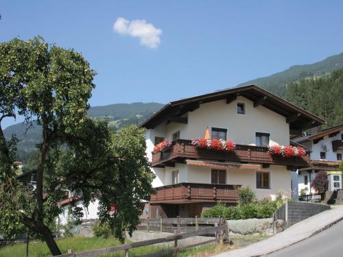 a building with flowers on the balconies of it at Apartment with balcony in Hart im Zillertaler in Fügen