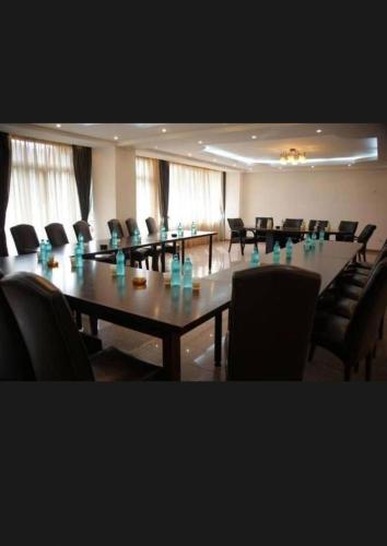 a meeting room with a long table and chairs at Hotel Bran Dracula in Bran