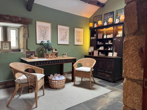 a room with chairs and a table and a counter at Holdsworth House Hotel in Halifax