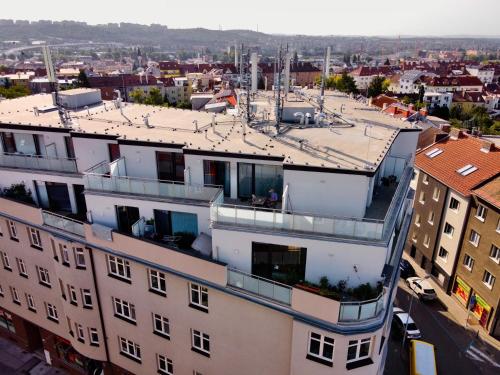 an apartment building with a view of a city at Star Apartments Brno #5C515 by Starbnb EU in Brno
