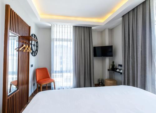 Letto o letti in una camera di Discovery Hotel
