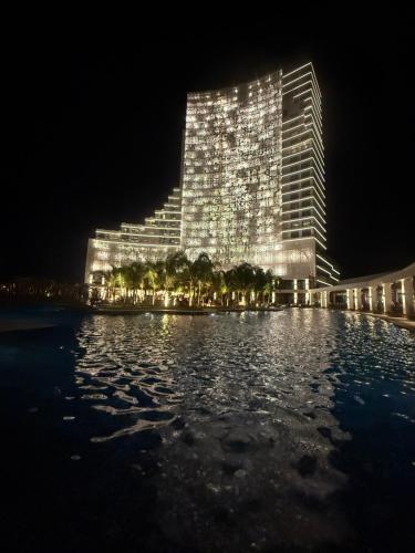 a large building with lights on it at night at Grand Sapphire 22 floor B BLock 377, Cypr Północny in Paralimni