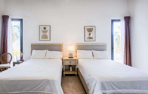 Voodi või voodid majutusasutuse VILLA CORAL Tracadero Beach Resort toas