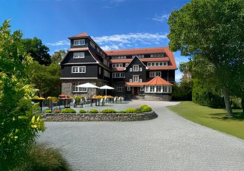 a rendering of a large black building at Wohnpark Hotel Heppenheim in Heppenheim an der Bergstrasse