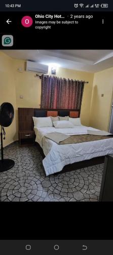 a bedroom with two beds in a room at Ohio city hotel in Owerri