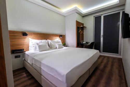 Letto o letti in una camera di Discovery Hotel