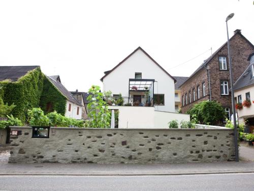 a house with a basketball hoop on top of a stone wall at Ernst Lakeside Escape in Ernst