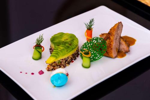 a white plate with different types of food on it at Sonesta Nouba Hotel Aswan in Aswan