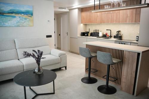 a living room with a couch and a table at Sucro Playa Apartment in Cullera