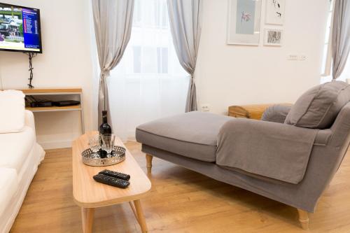 a living room with a couch and a coffee table at Split Center brand new Apartment Jazzy in Split