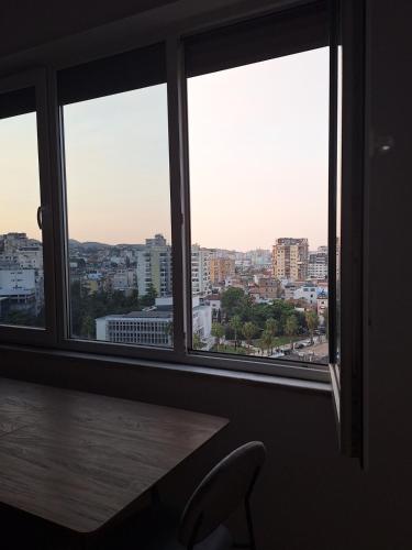 a view of a city from a window at Central City Apartment in Durrës
