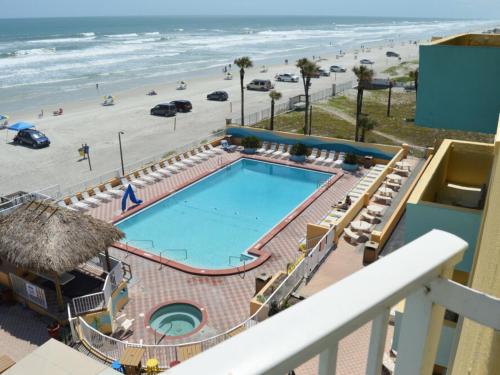 a view of a swimming pool and the beach at The Salty Fountain in Seabreeze