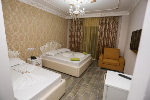 Ένα ή περισσότερα κρεβάτια σε δωμάτιο στο Hotel Antalya - Beach Durres