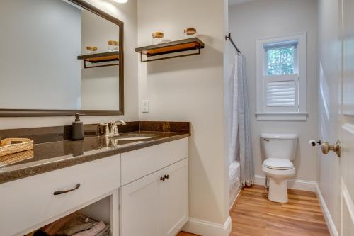 a bathroom with a sink and a toilet at Stylish Arundel Cottage, 6 Mi to Dock Square! in Arundel