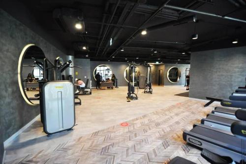 a gym with treadmills and exercise equipment in a room at Lovely Modern 1bd Condo Views W Poolgym! #222 in Istanbul