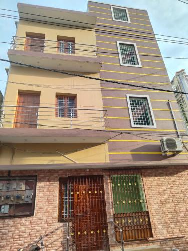 a tall building with a balcony on top of it at Bnr babu naidu residency unit 2 in Vellore