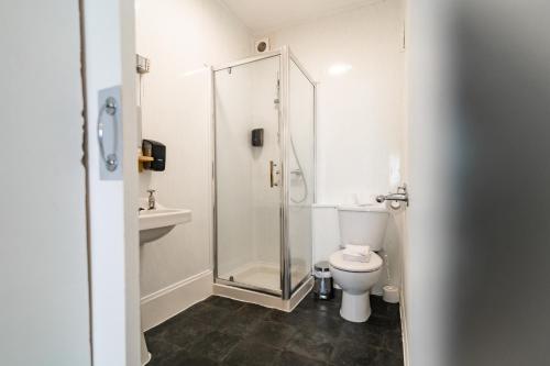 a bathroom with a shower and a toilet at The Southcliff Hotel in Folkestone