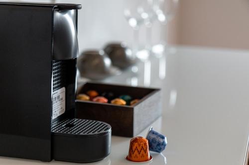 a box of fruit sitting next to a coffee maker at Penzion U Kapličky in Malá Hraštice