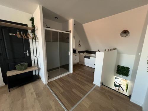 a hallway with a sliding glass door in a house at Le Jardin Botanique in Lens