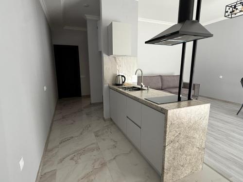 a kitchen with a sink and a counter top at Areni Vista Guesthouse in Areni