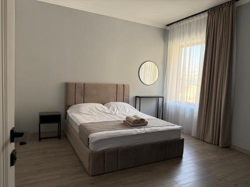a bedroom with a large bed and a window at Areni Vista Guesthouse in Areni