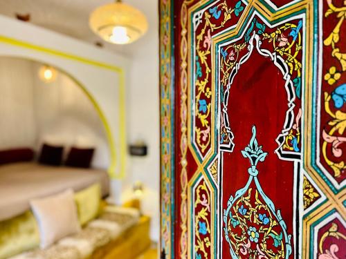 Una cama o camas en una habitación de Dar Meziana