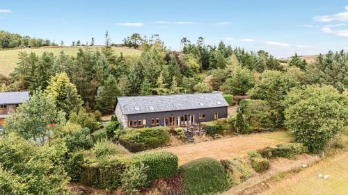 an aerial view of a house in a field at Glanyrafon in Rhayader