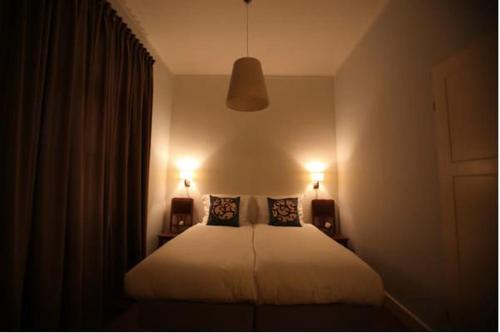 Ένα ή περισσότερα κρεβάτια σε δωμάτιο στο villa issum