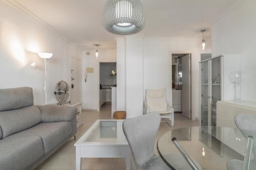 a living room with a couch and a table at Casa Ricardo in Barbate