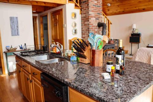 a kitchen with a sink and a counter top at Lake Christopher Cabin in Bryant Pond
