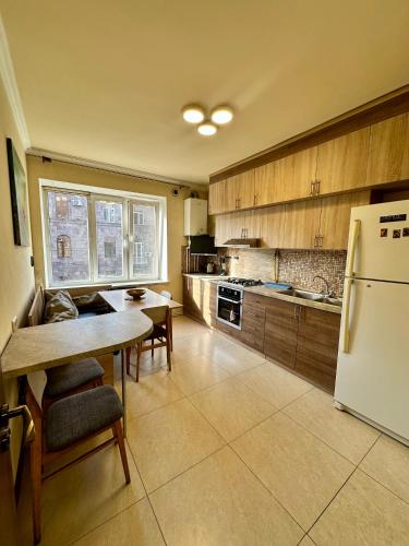 Unique Apartment tesisinde mutfak veya mini mutfak