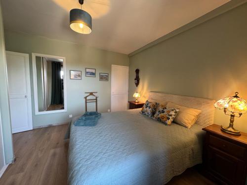 Кровать или кровати в номере Le Lodge de Serenite