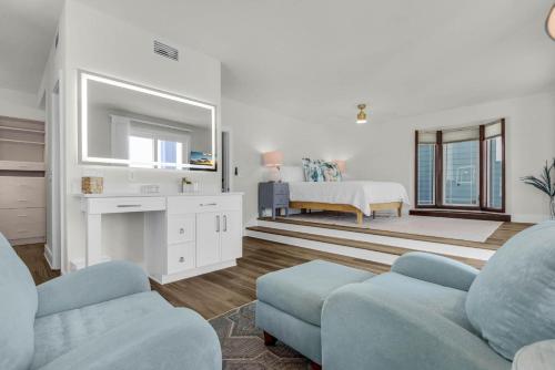 a living room with a couch and a bed at The Gulfview Grandeur in Pensacola Beach