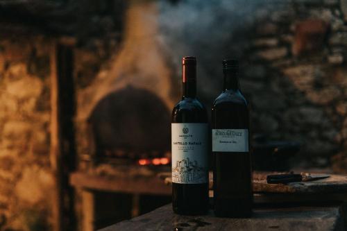 two bottles of wine sitting on top of a table at Laura in Rapale
