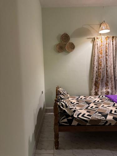 a bedroom with a bed and a window at BEACHO 2 bhk private entire villa southcliff varkala in Varkala