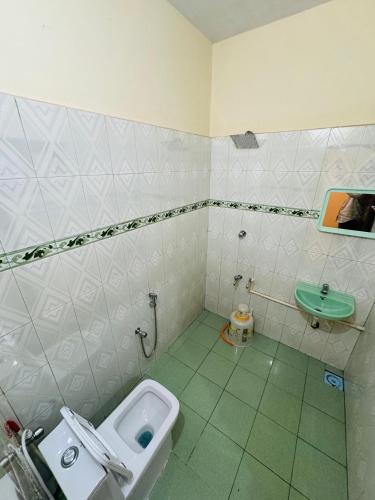 a bathroom with a toilet and a sink at BEACHO 2 bhk private entire villa southcliff varkala in Varkala