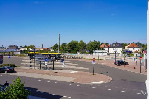 an empty parking lot with a street with cars at Apart Hotel Leipzig Taucha in Taucha