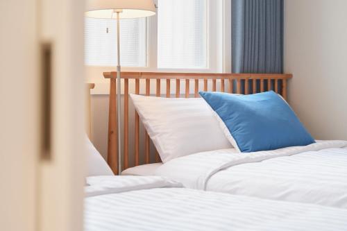 Ένα ή περισσότερα κρεβάτια σε δωμάτιο στο Seodam Stay - 8 Min Walk from Seoul Station Well-Connected #Hongdae #DDP