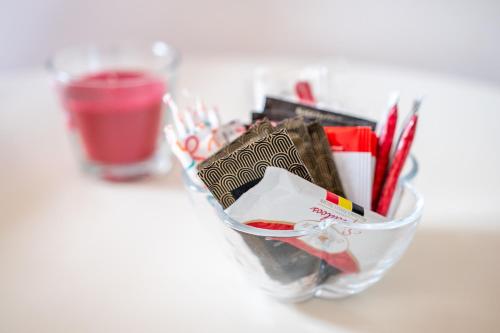 a glass container filled with office supplies on a table at Gdańska 44 Apart in Łódź