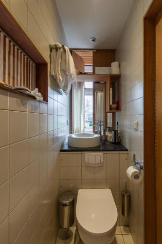 a bathroom with a toilet and a sink at SWEETS - Buiksloterdraaibrug in Amsterdam