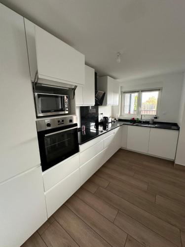 Virtuvė arba virtuvėlė apgyvendinimo įstaigoje Appartement près de Metz