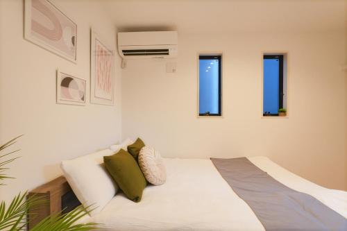 Postel nebo postele na pokoji v ubytování Tomo House Yotsuya-Sanchome 101 - from 6 minutes station 四谷三丁目 101 駅から徒歩6分