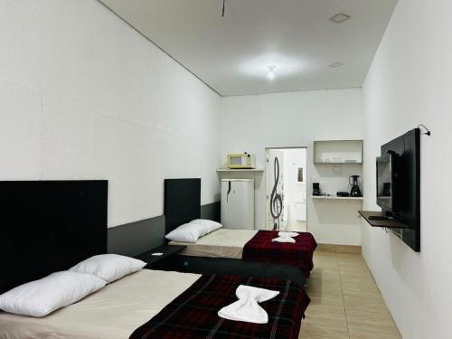 Postel nebo postele na pokoji v ubytování Studio espaçoso e confortável em São Paulo ZN