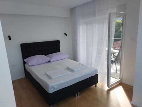 Giường trong phòng chung tại Apartments Bevanda