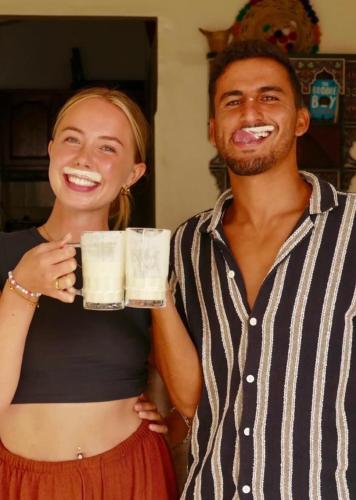 a man and a woman holding glasses of milk at Imsouane Vibe Surf house in Imsouane