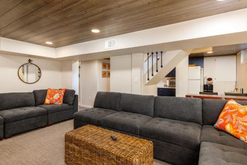 a living room with a couch and a table at Crane Haven - Walk to CyRide Games & Grill in Ames