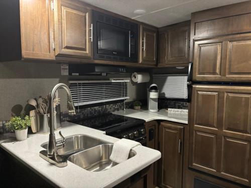 a kitchen with a sink and a microwave at Skull Creek custom 2 in Round Top