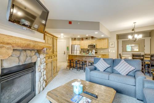 a living room with a couch and a fireplace at Walk to Lifts Copper Mtn Condo in Center Village! in Frisco